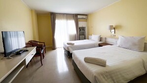 A hotel room with two beds, a TV, a desk, and a chair. - Rajpracha Pakchong (Pak Chong)