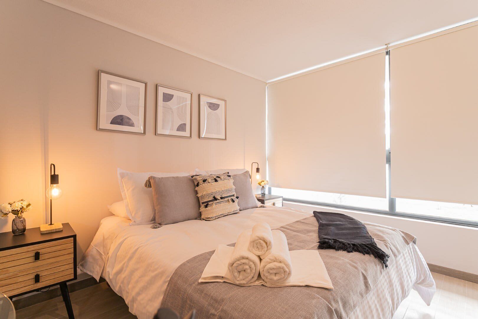 Unwind in this stylish studio with a plush bed and modern decor, offering a serene retreat in the heart of Chile.