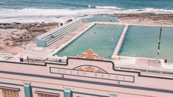 A view of Ocean Baths with a pool and a beach area.