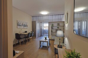 Apartment, 1 Bedroom, Balcony, City View | Living room | Books - Zeusplace Aphrodites Sanctuary 1 (Katerini)