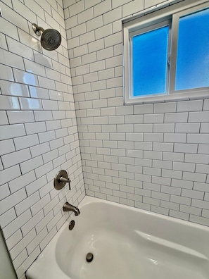 Shower, hair dryer, towels, shampoo
