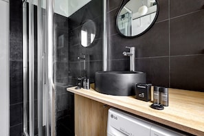 Shower, hair dryer, towels, shampoo