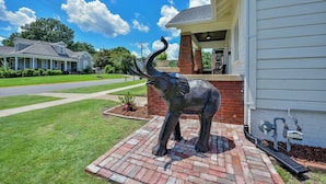 A house with a brick patio and a metal elephant sculpture. - Heisman House - Book for football season!  Walk to Stadium! (Tuscaloosa)