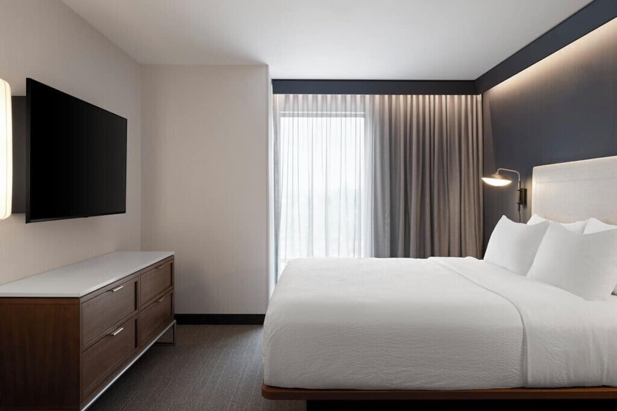 Premium bedding, blackout drapes, iron/ironing board