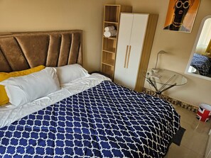 Family Apartment, 3 Bedrooms, Kitchenette, Garden View | 3 bedrooms, desk, laptop workspace, iron/ironing board - Seven Palms Executive Lodge (Ndola)