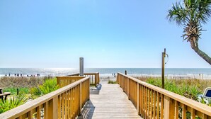 A wooden boardwalk leading to a beach with a clear view of the ocean. - Gorgeous, Epic Ocean View, & Steps to Beach! Lazy River, Pools, HotTub! (Myrtle Beach)