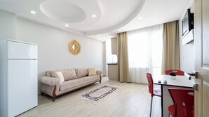 Family Apartment, 1 Bedroom, Sea View | Living area | TV - Şehri Saray Apart Oteli (Tekirdag)