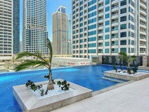 Outdoor pool, a heated pool - Elegant 1BR APT with Gym, Pool and other amenities (Dubai)