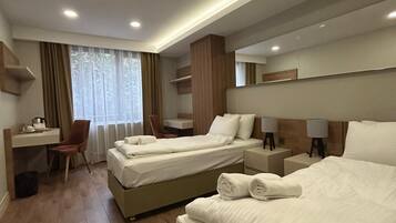 Desk, laptop workspace, free WiFi, bed sheets