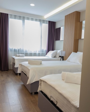 Desk, laptop workspace, free WiFi, bed sheets