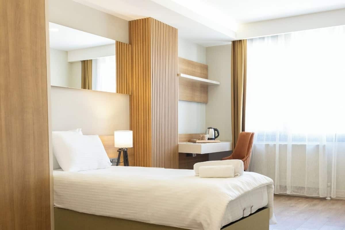 Desk, laptop workspace, free WiFi, bed sheets