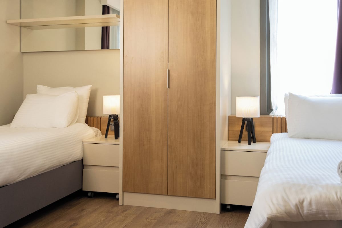 Desk, laptop workspace, free WiFi, bed sheets