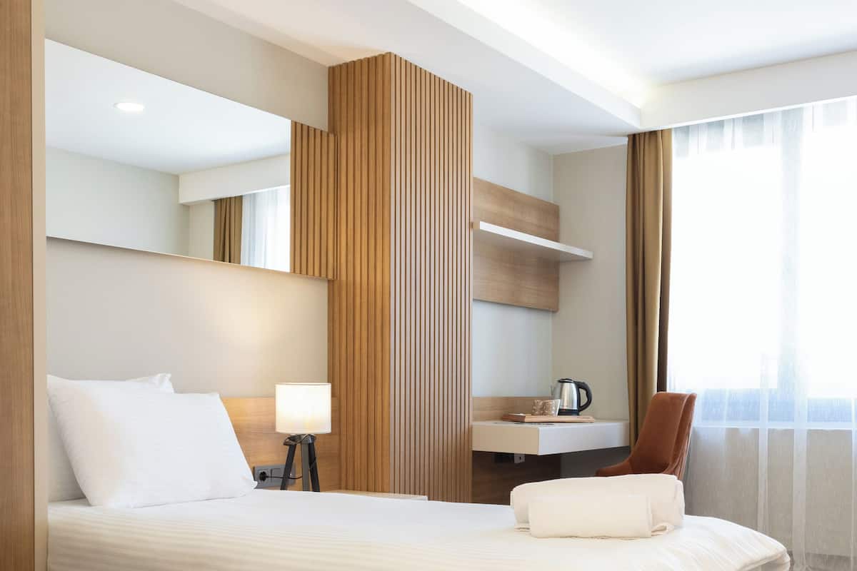 Desk, laptop workspace, free WiFi, bed sheets