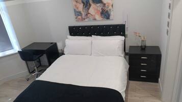 1 bedroom, desk, iron/ironing board, bed sheets