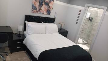 1 bedroom, desk, iron/ironing board, bed sheets