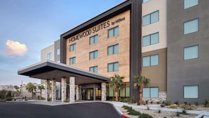 A hotel with a modern facade, featuring a sign that reads "Homewood Suites by Hilton." - Homewood Suites By Hilton North Las Vegas Speedway (North Las Vegas)