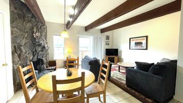 Condo, 1 Queen Bed with Sofa bed, Balcony, Mountain View (Panorama 203) | Living area | 32-inch TV with cable channels, fireplace