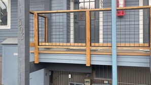 A building with a wooden balcony and a sign stating "PARKING BY PERMIT ONLY." - Panorama 203 (Breckenridge)