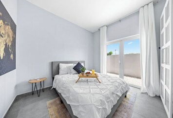 Relax and unwind in this cozy queen bedroom, designed for your ultimate comfort.