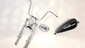 A bicycle with a front light, rear light, and a black object with text. - Cuba Mía  (Burriana)