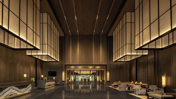 A spacious lobby with a modern design, featuring a marble reception desk, seating area, and a large entrance. - Doubletree By Hilton Kaifeng (Kaifeng)