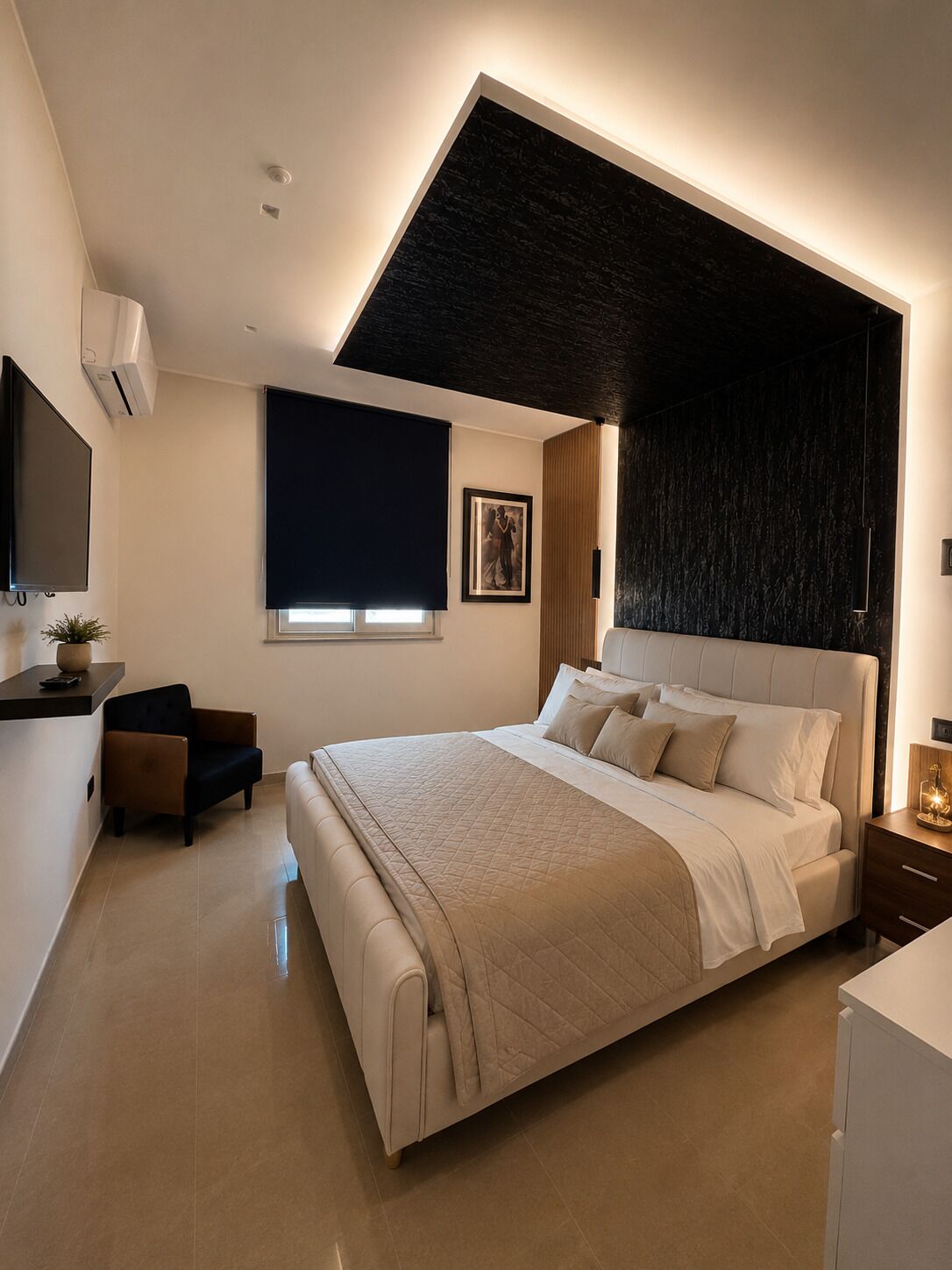 A modern bedroom with a large bed, a desk, and a chair.