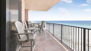 A balcony with outdoor seating and a view of the ocean. - Four Seasons 502-e Pier Newly Remodeled (Orange Beach)