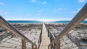 A wooden boardwalk leading to a beach with a clear sky. - Lil Tip Sea 8 BR Private Pool Elevator Beach (Gulf Shores)