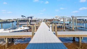 A marina with docked boats and a clear sky. - Portside 204 Best of Beach Bay (Pensacola)