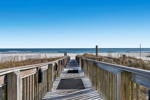 A wooden boardwalk leading to a beach with a clear sky. - Shoalwater 906 3 3 Gulf-front Corner-unit (Orange Beach)