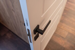 A white door with a black handle and a white door frame.