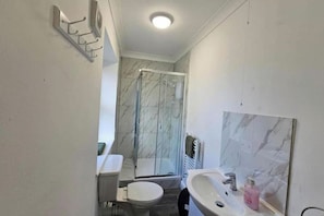 Shower, free toiletries, hair dryer, towels
