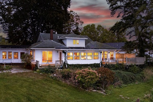 The backyard has full views of the lake, & leads down to the water. No swimming.