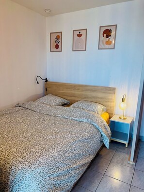 1 bedroom, desk, iron/ironing board, travel crib