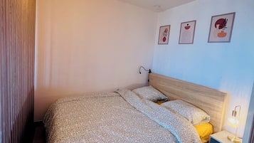 1 bedroom, desk, iron/ironing board, travel crib