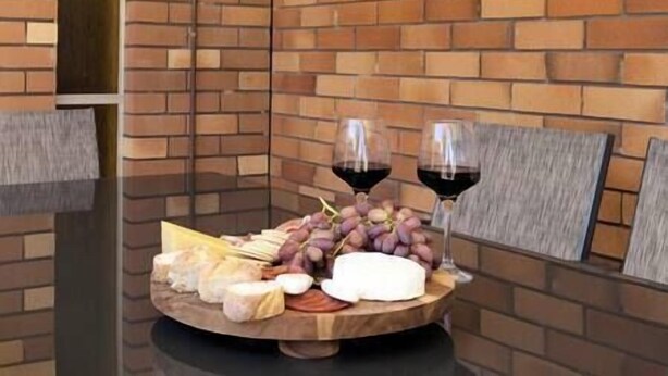 A cheese platter with grapes and wine glasses on a wooden board. - Private Pool | Sleeps 12 | Pets | Basketball Hoop (Coffs Harbour)