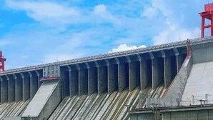 A large dam with multiple spillways and a red structure on top. - Danjiangkou Xinlong Hotel (Danjiangkou)