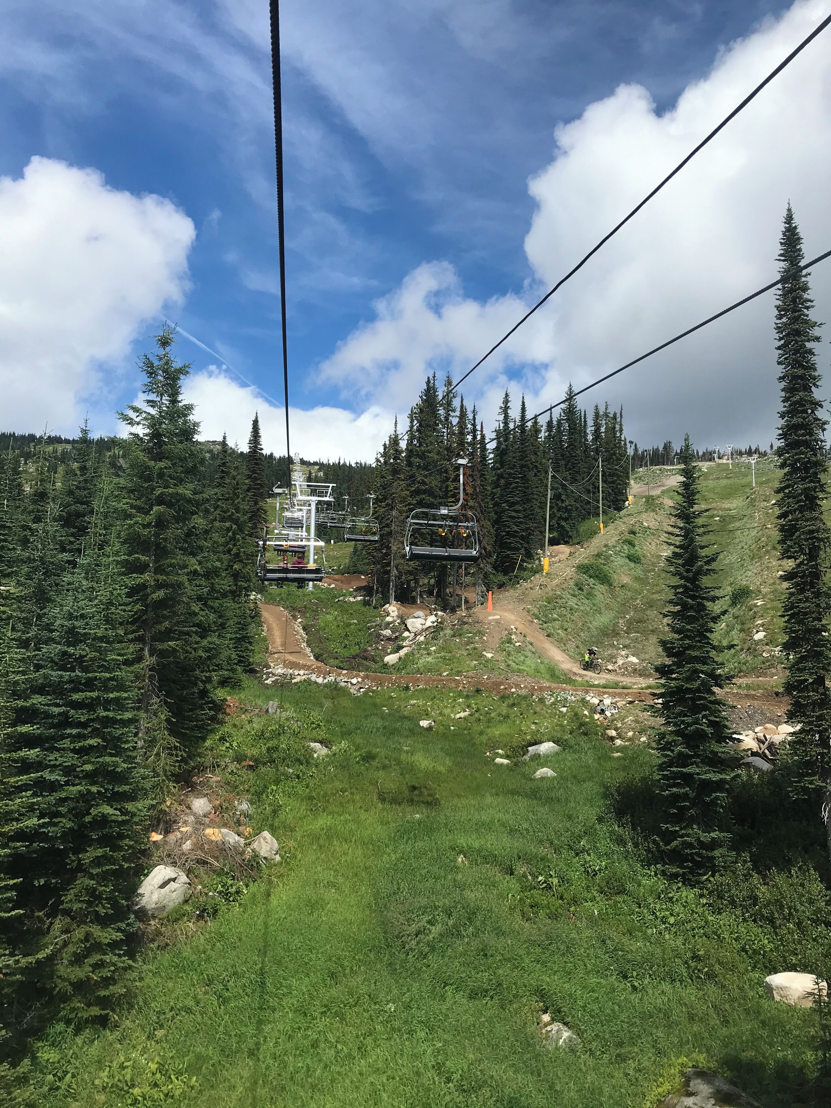 A ski lift with a chairlift and a mountain path.