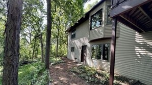A two-story house with a dirt path leading to the front door. - Harmony House, spacious 5-bedrooms in downtown Baraboo near Devil's Lake Park (Baraboo)