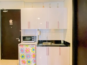 Appartamento | Cucina privata | Frigorifero, microonde, piano cottura, risottiera