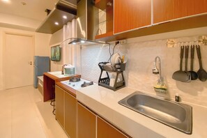 Apartment | Private kitchen | Fridge, stovetop, rice cooker, dining tables - 1Br With Pool View At Parahyangan Residence Apartment (Bandung)