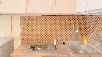 Apartment | Private kitchen | Fridge, stovetop, rice cooker, dining tables