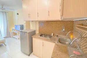 Apartment | Private kitchen | Fridge, stovetop, rice cooker, dining tables - Good Place And Homey At 2Br Kebagusan City Apartment (Jakarta)