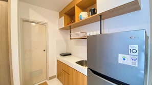 Appartamento | Cucina privata | Frigorifero, piano cottura, risottiera, tavolo da pranzo