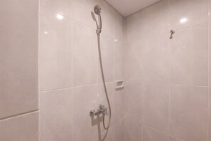 Studio | Bathroom | Shower, towels - Cozy Living Studio At Serpong Garden Apartment (Cisauk)