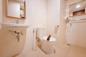 Studio | Bathroom | Shower, towels - Comfort Studio (No Kitchen) At Mataram City Apartment (Ngaglik)