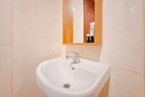 Studio | Bathroom | Shower, towels - Comfort Studio (No Kitchen) At Mataram City Apartment (Ngaglik)