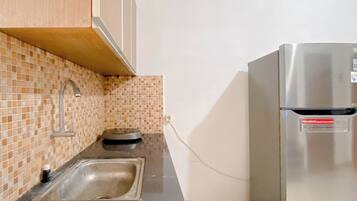 Appartamento | Cucina privata | Frigorifero, piano cottura, risottiera