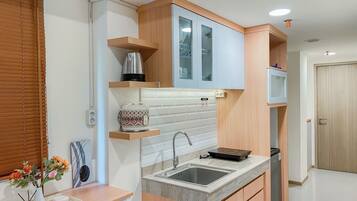 Apartment | Private kitchen | Fridge, stovetop, rice cooker, dining tables