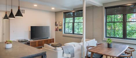 Deluxe Suite, 1 King Bed | Living area | LCD TV, Netflix, streaming services, music library